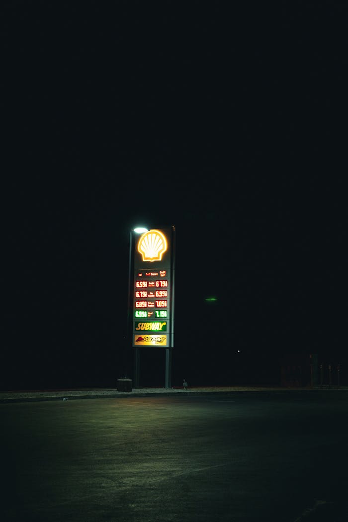 gallery-5 A glowing gas station sign in the dark, capturing urban nightscape atmosphere.