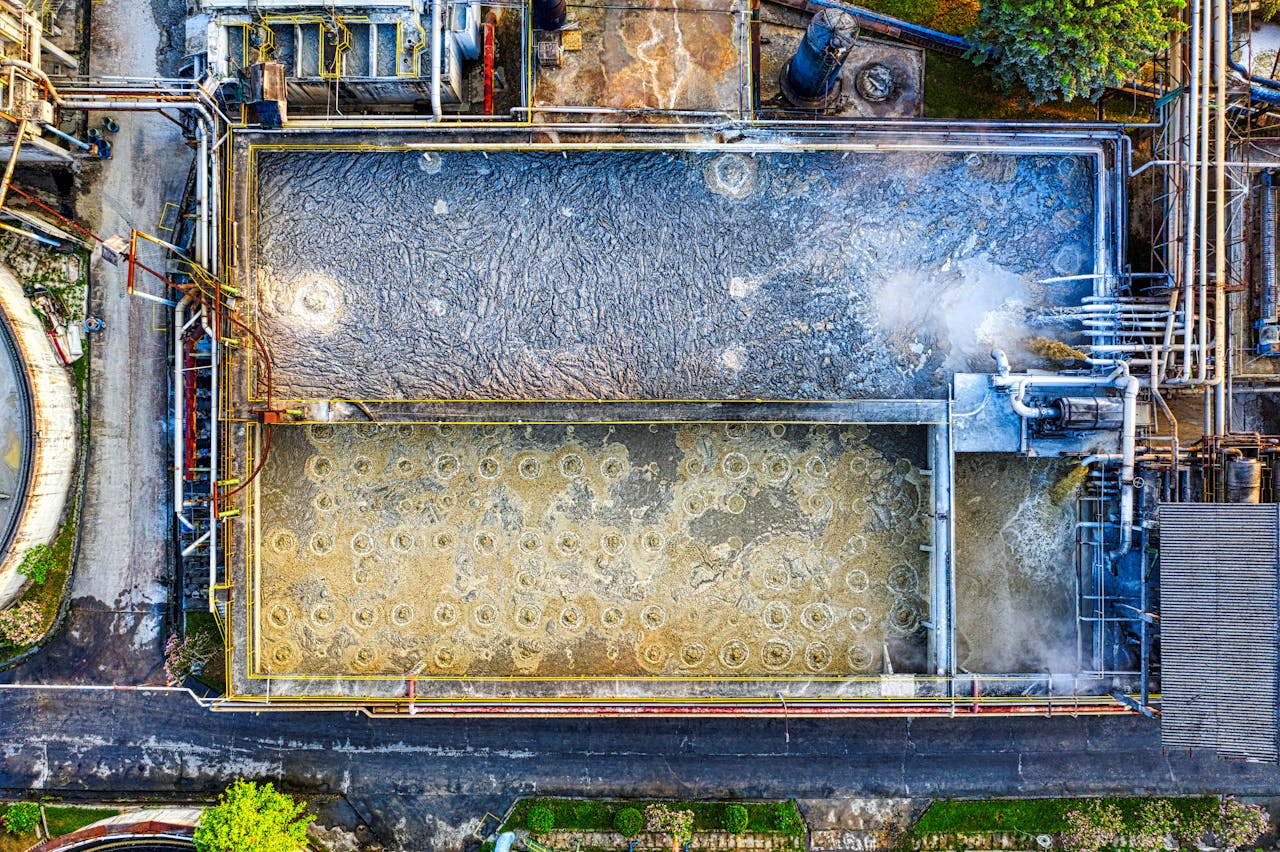 services-img Overhead shot of a water treatment plant highlighting industrial processes.